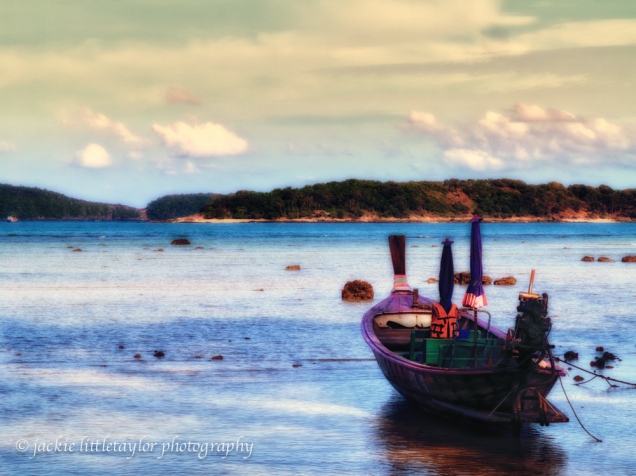 longtail boat sunset blue waters pastel soft impression